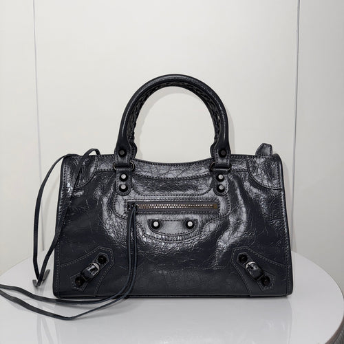 Balenciaga leather handbag with top handles, front zip pocket, black finish
