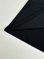 Black short-sleeve T-shirt hem and side seam detail