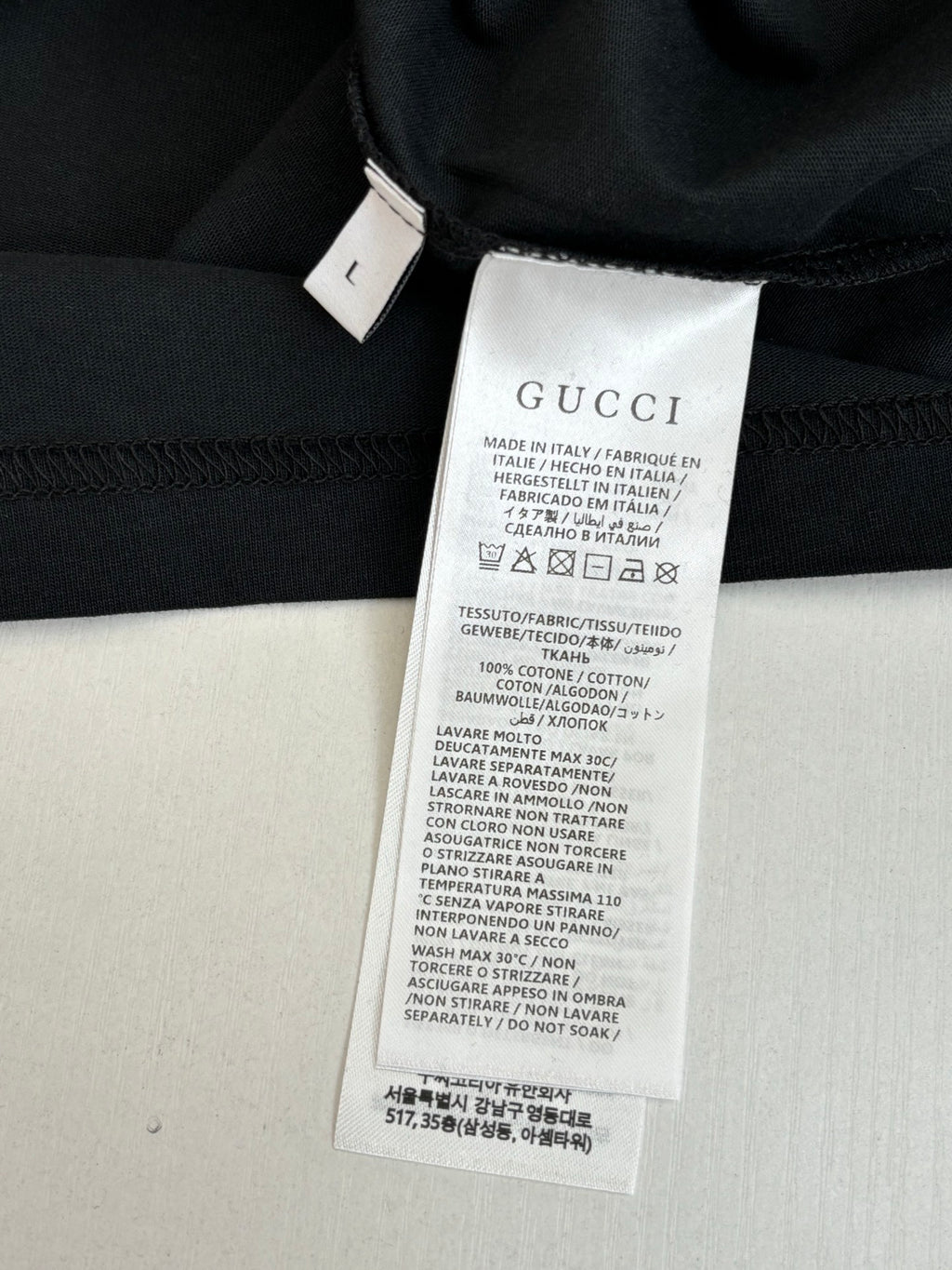 Gucci T-shirt care label tag on inner neckline