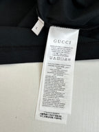 Gucci T-shirt care label tag on inner neckline