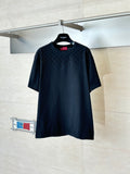 Black short-sleeve T-shirt with subtle all-over pattern, crew neck, on a hanger