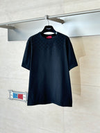 Black short-sleeve T-shirt with subtle all-over pattern, crew neck, on a hanger