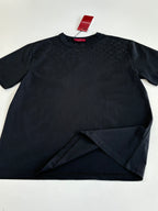 Black short-sleeve T-shirt laid flat with red Gucci neck label