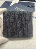 Small bag with Dior monogram fabric, navy, front view with Dior logo.