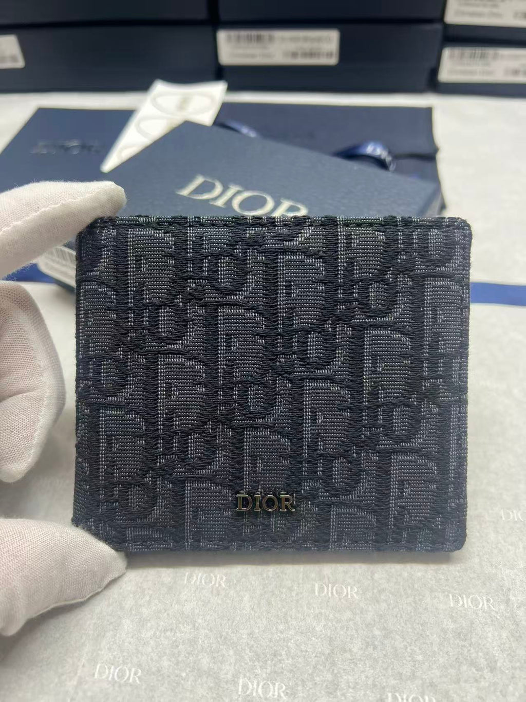 Small bag with Dior monogram fabric, navy, front logo panel and flap.