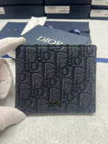 Small bag with Dior monogram fabric, navy, front logo panel and flap.