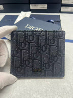 Small bag with Dior monogram fabric, navy, front logo panel and flap.