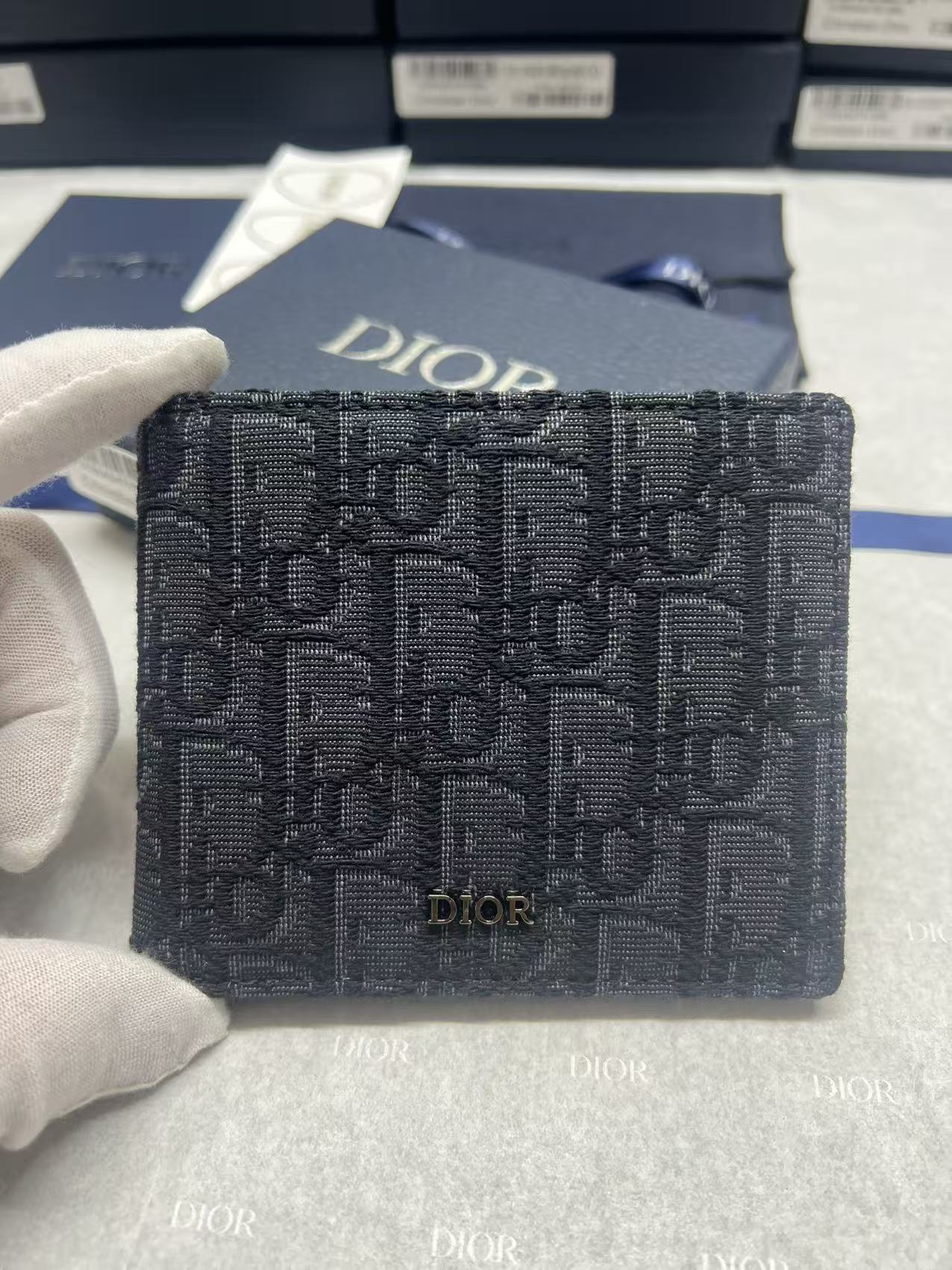 Small bag with Dior monogram fabric, navy, front logo panel and flap.
