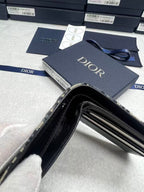 Small bag Dior monogram pouch open with black interior and zipper closure visible