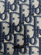 Small bag Dior monogram jacquard close-up in navy and cream with Dior lettering