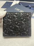 Small leather card holder with Dior embossed monogram texture, black front.