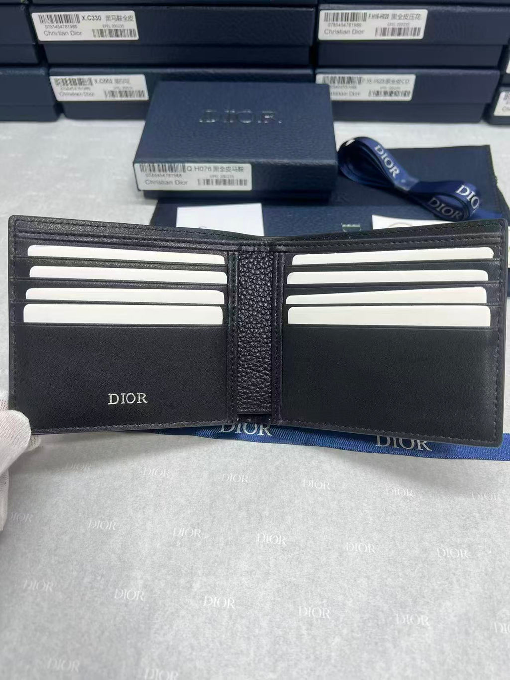 Small leather card holder with multiple card slots, Dior logo, black.