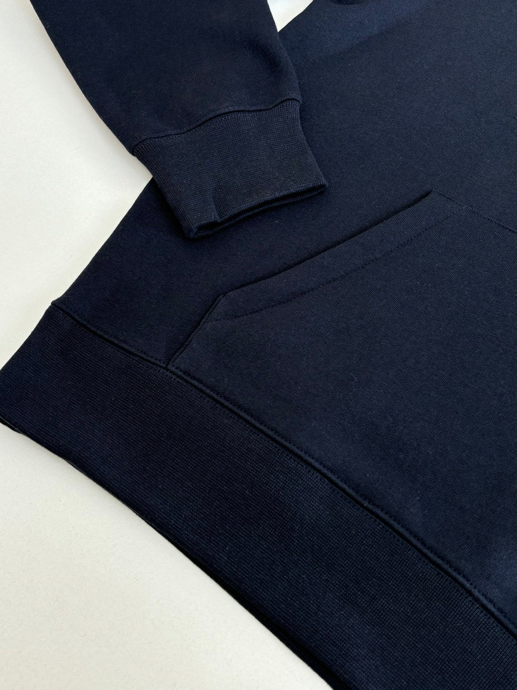Navy Fendi hoodie sleeve and side hem with stitched seams