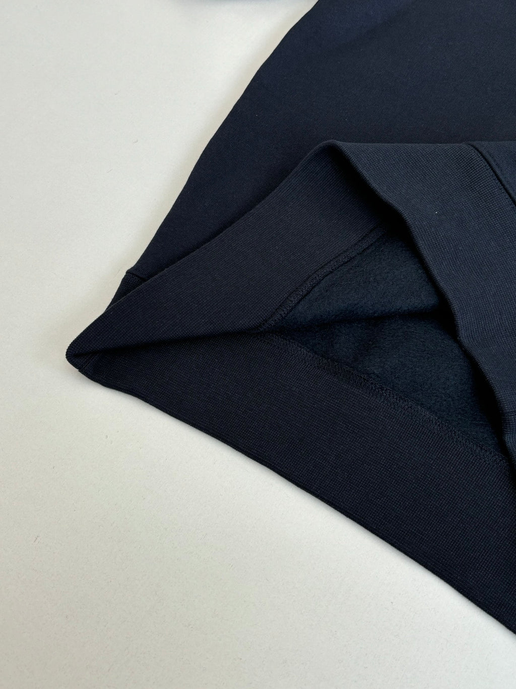 Navy Fendi hoodie fabric fold at hem