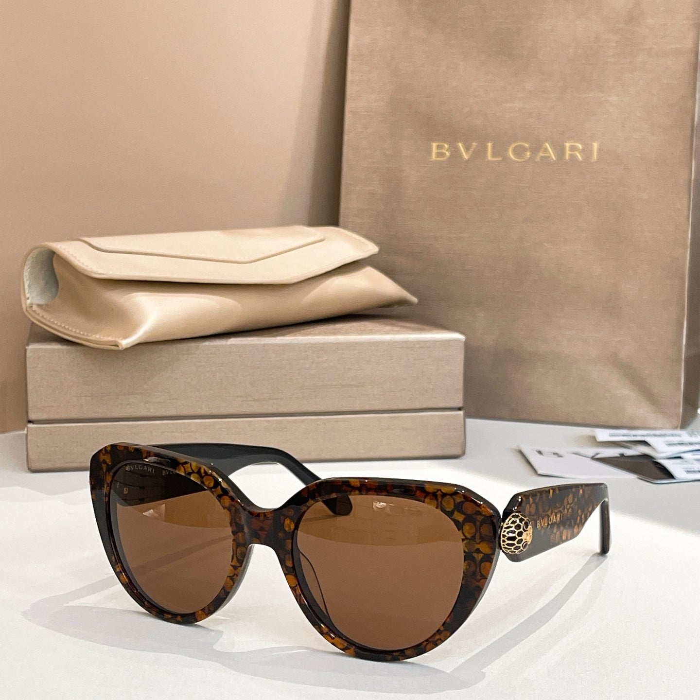 Bvlgari sunglasses with tortoiseshell frames and amber lenses, cat-eye shape