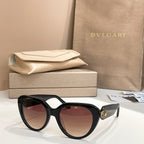 Bvlgari sunglasses with dark frames and tinted lenses, cat-eye shape