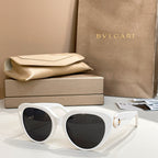 Bvlgari sunglasses with white frames and dark lenses, cat-eye shape