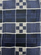 Louis Vuitton plaid fabric close-up with dark navy, white, and blue grid checks