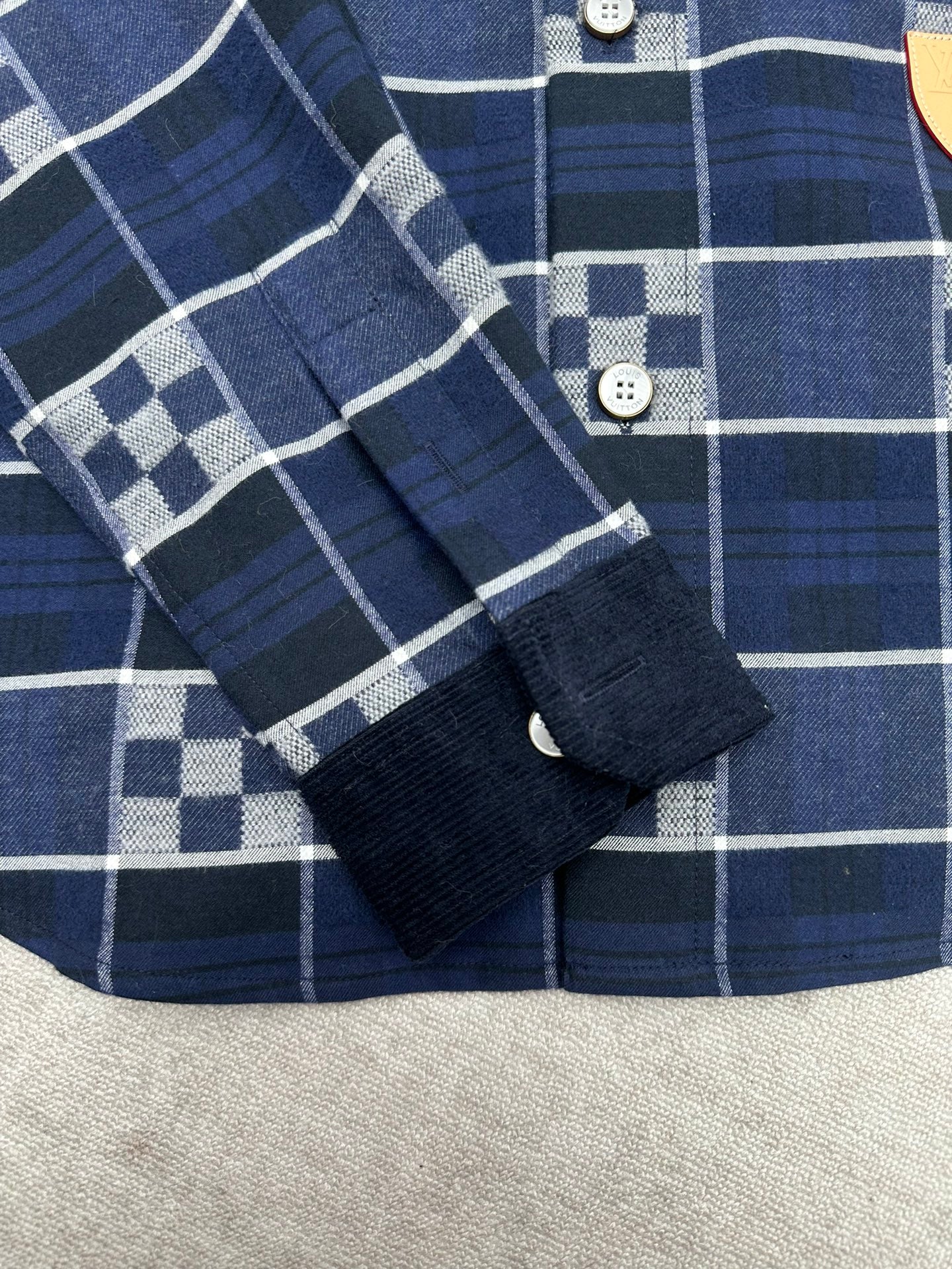 Louis Vuitton plaid shirt cuff and sleeve with dark navy and white check stripes