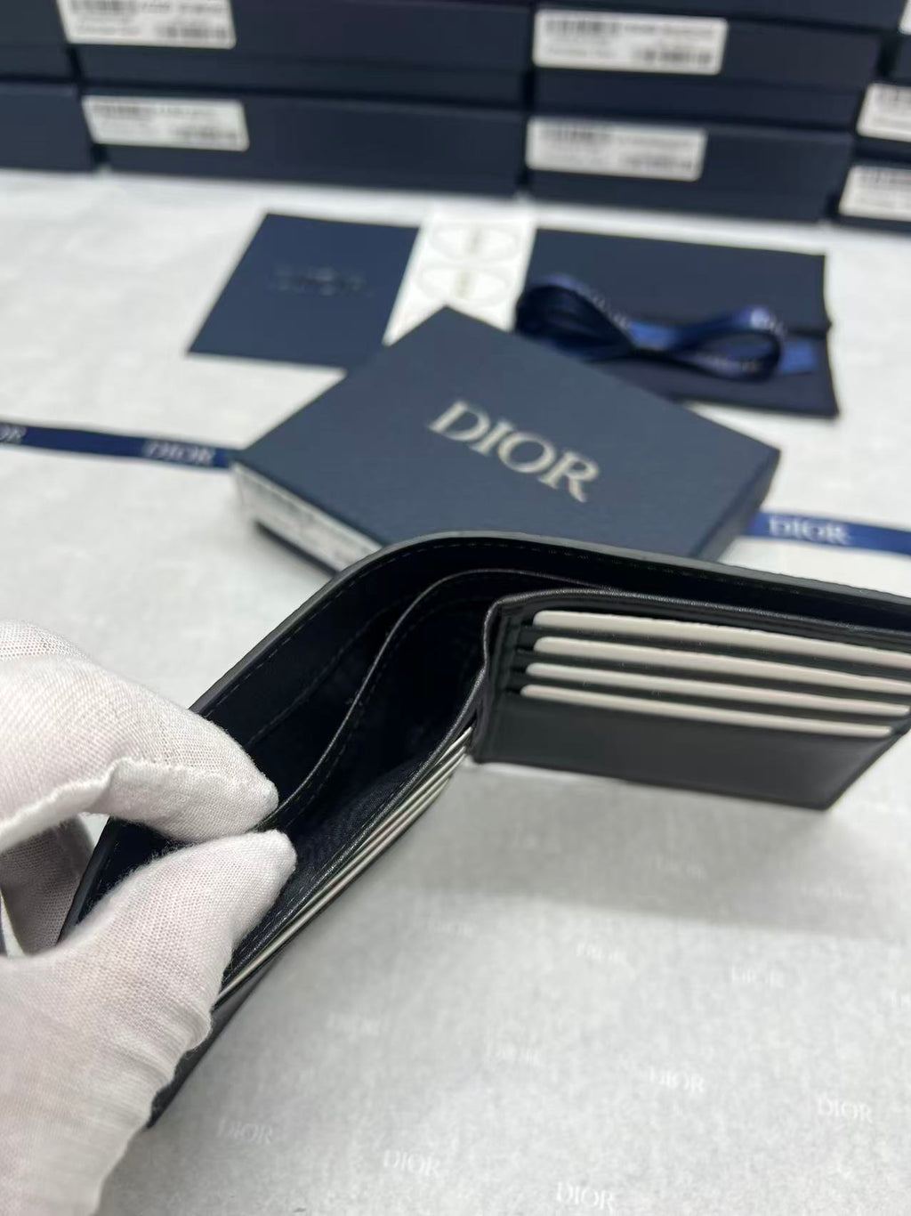 Small leather wallet, open view with card slots and divided interior pockets