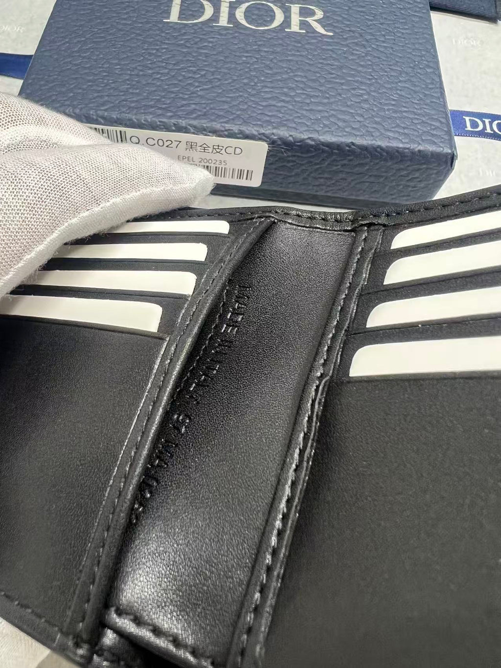 Small bag wallet with black leather and stitched card pockets, Dior lettering.