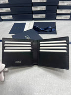 Small leather wallet, open interior with card slots and Dior logo on panels