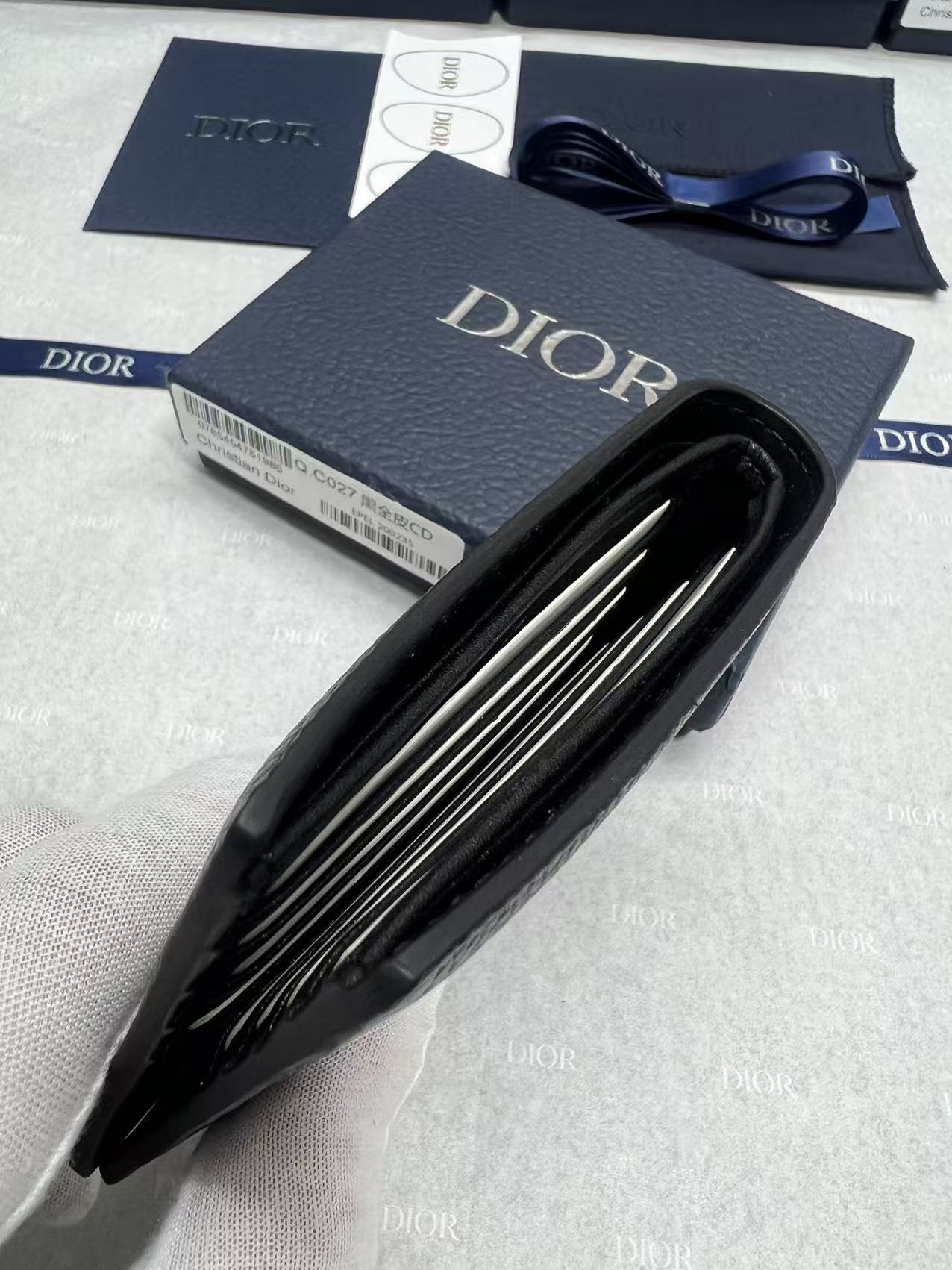 Small leather wallet, open view showing multiple interior card slots
