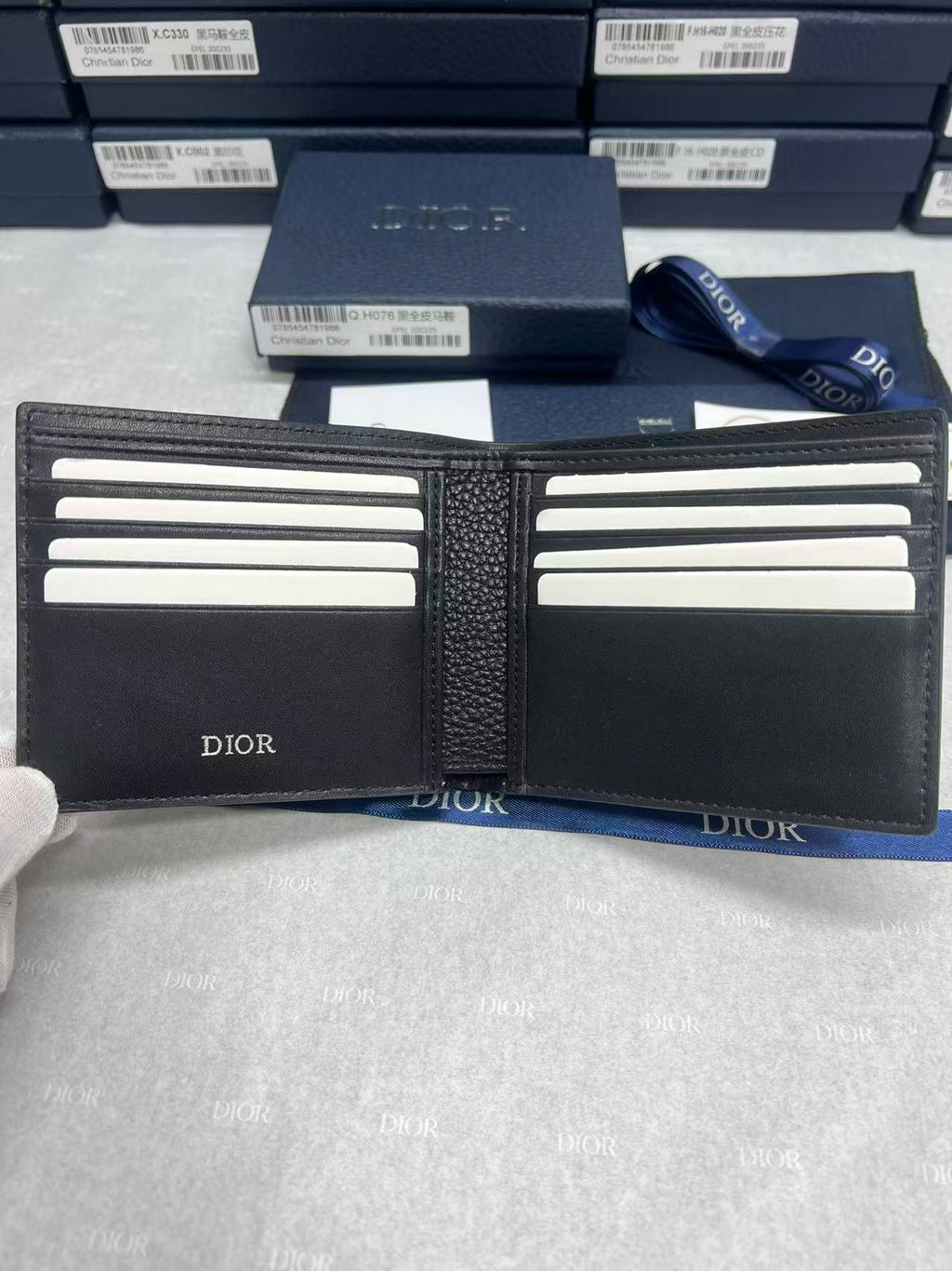 Black leather small wallet interior with multiple card slots and Dior logos