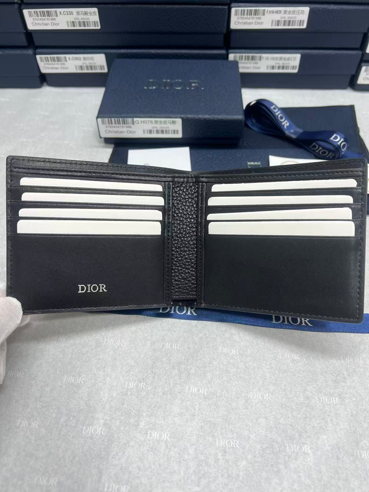 Black leather small wallet interior with multiple card slots and Dior logos