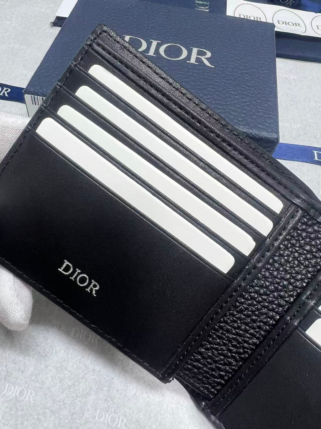 Black leather small wallet interior with card slots, Dior logo on side panel