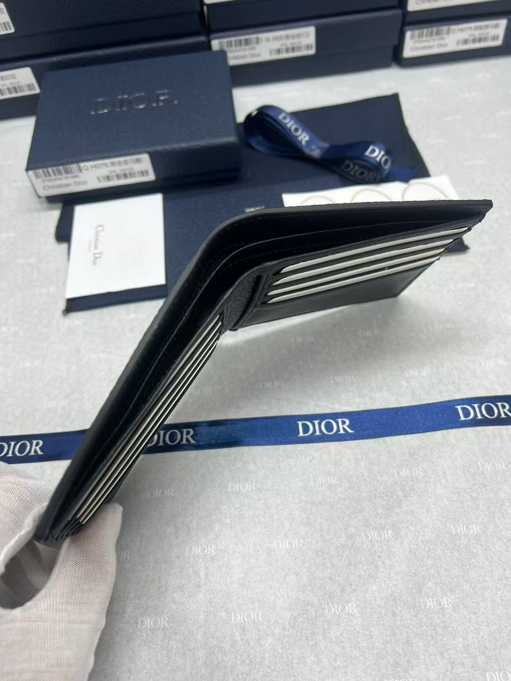 Small bag side view showing folded interior and card slot lining