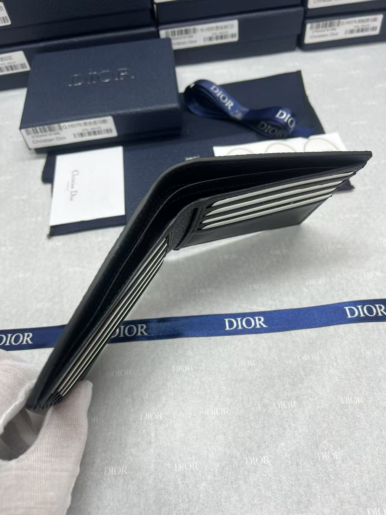 Small bag side view showing folded interior and card slot lining