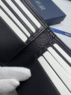 Small bag Dior leather card holder close-up with ribbed card slot lining and stitching