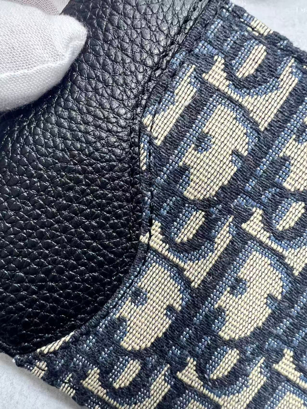 Small bag corner with navy Dior monogram jacquard and pebbled leather trim