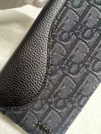 Dior bag side panel, black pebbled leather edge with gray oblique monogram fabric