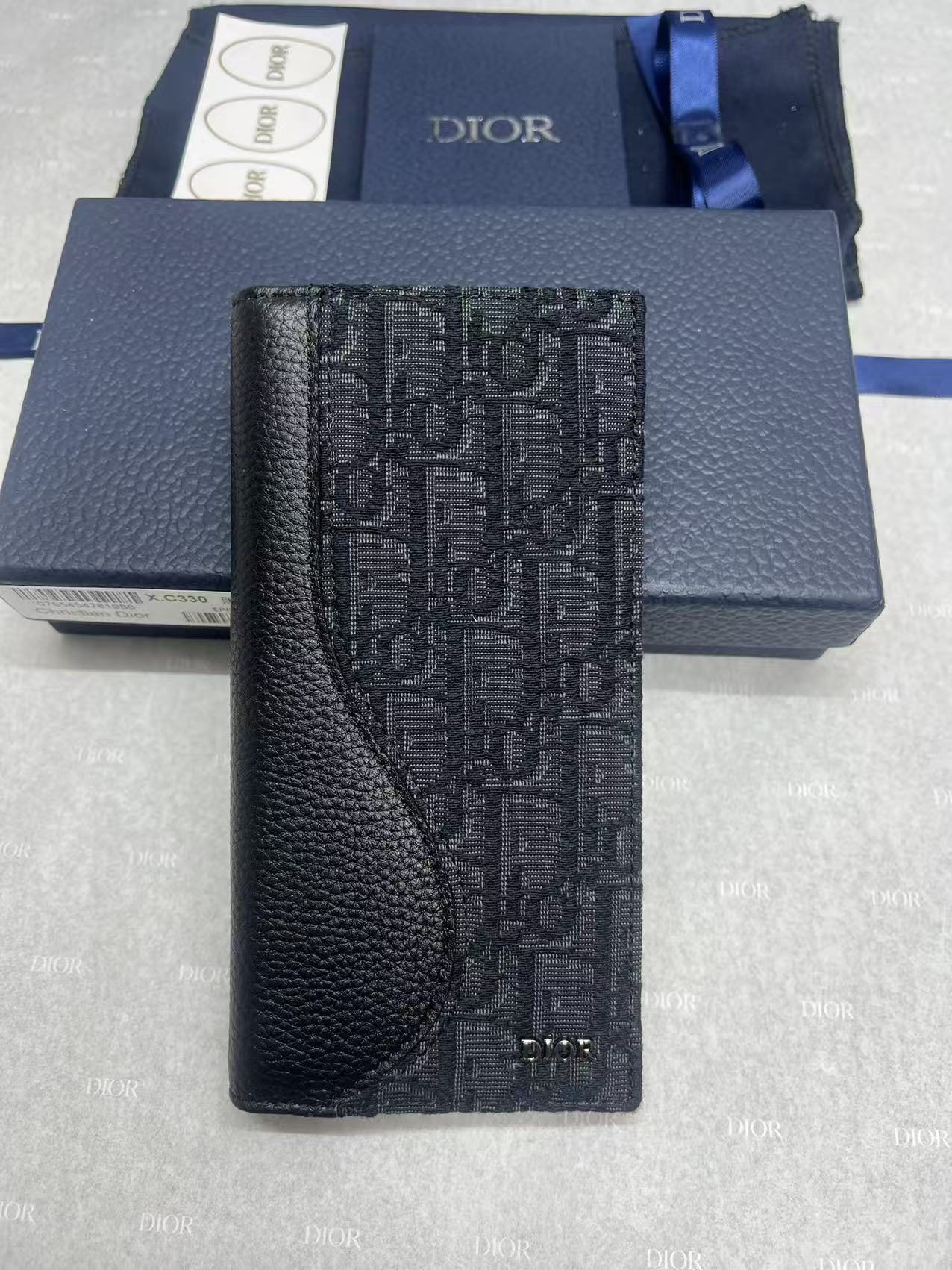 Dior bag with black oblique monogram panel and textured leather trim, front view