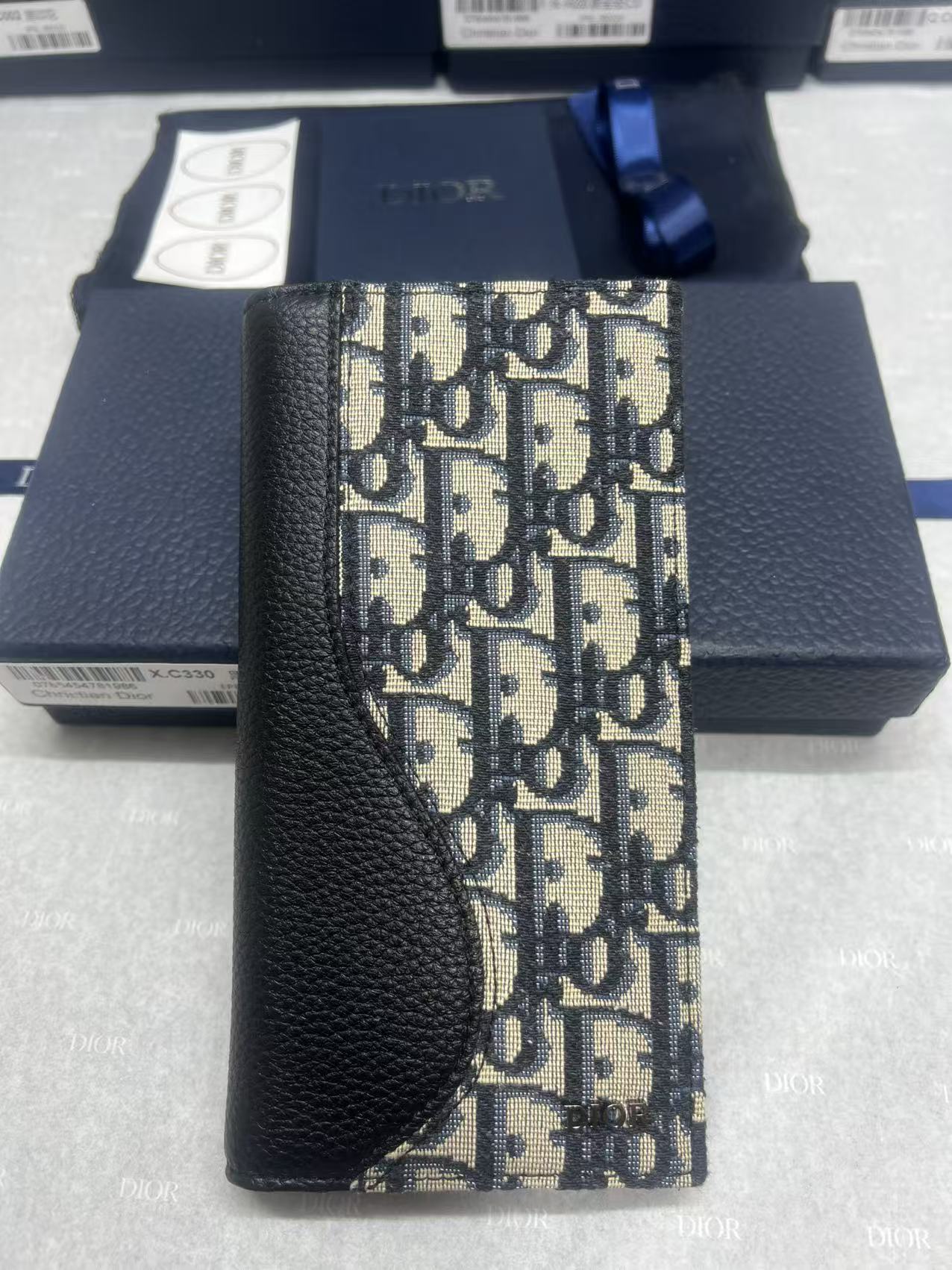 Dior small bag with textured black leather and woven monogram panel strap