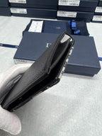 Dior small bag side view with black leather interior and silver-tone zipper