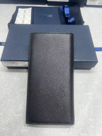 Dior small bag, textured black leather zip wallet, front view