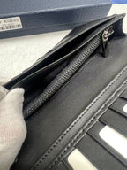Dior small leather wallet open corner showing zipper pocket and card slot lining