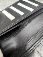 Dior small leather wallet interior close-up of card slots and stitched edges