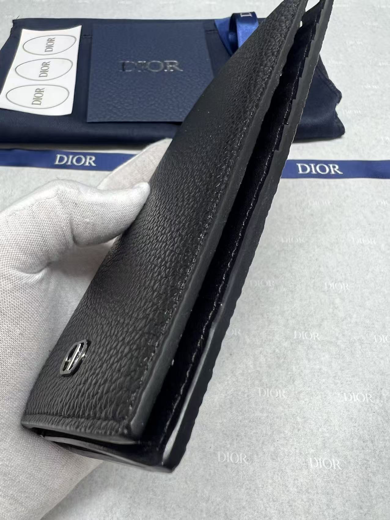 Dior small leather wallet, side view with metal snap detail