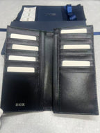 Dior small leather wallet open interior with multiple card slots and black lining