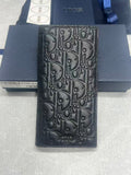 Dior small bag, dark textured leather with embossed logo pattern