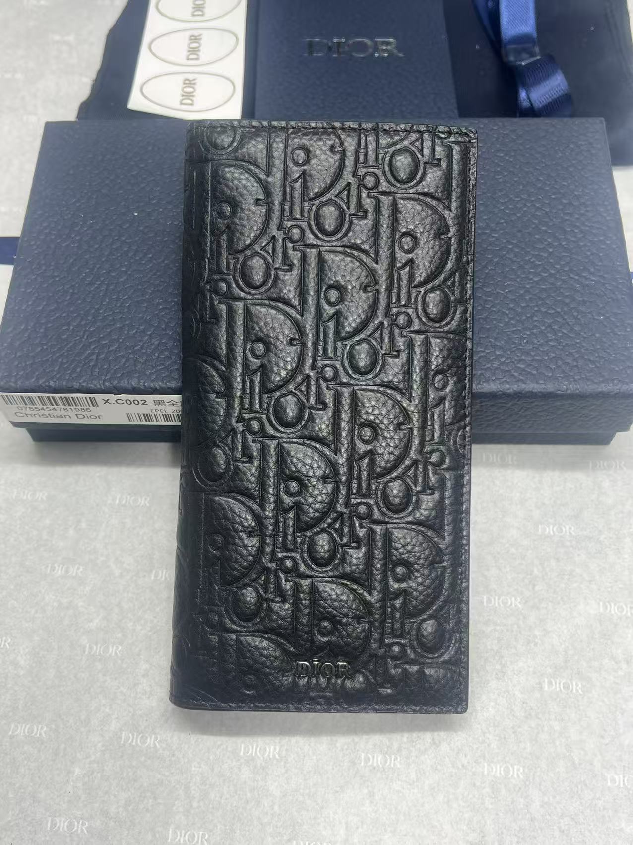 Dior small bag, dark textured leather with embossed logo pattern