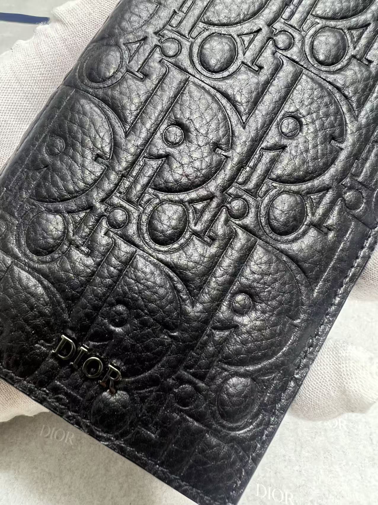 Dior small bag, dark leather with embossed monogram-style detail