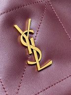 YSL pink leather panel with gold YSL logo emblem