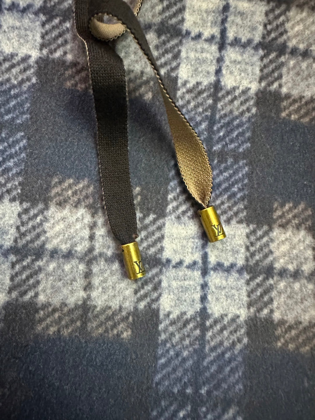 Plaid hoodie hood drawstrings with gold tips and metal aglets