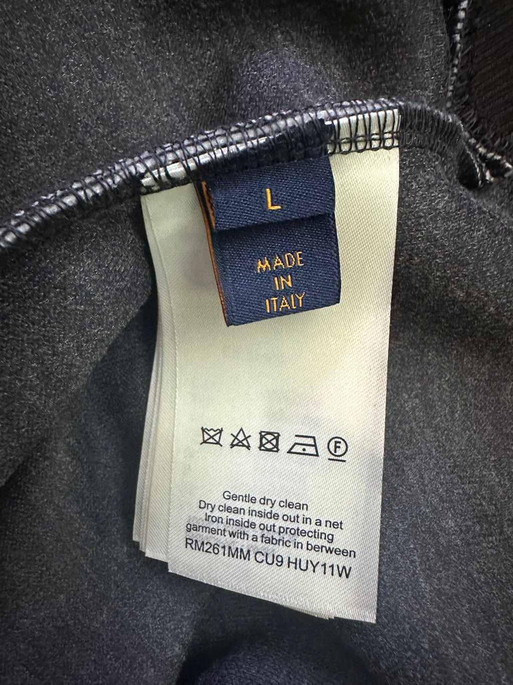 Hoodie care label showing "MADE IN ITALY" and cleaning instructions