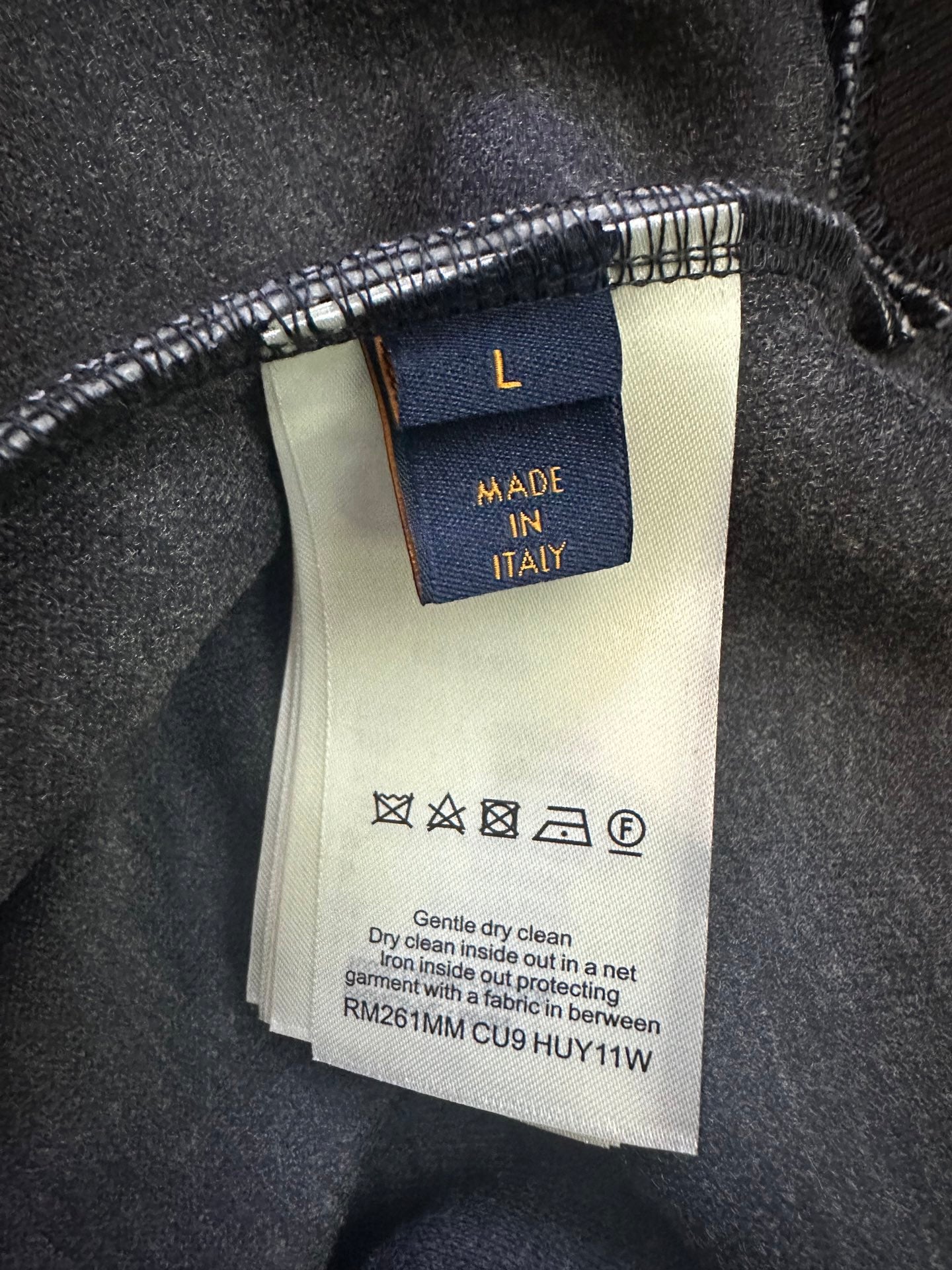 Hoodie care label showing "MADE IN ITALY" and cleaning instructions